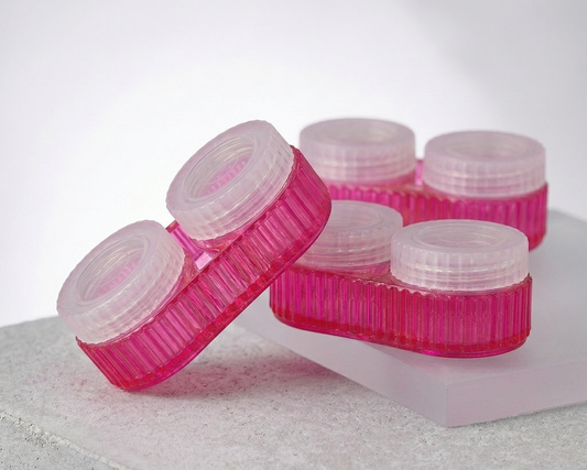 three pink jade contact lens cases