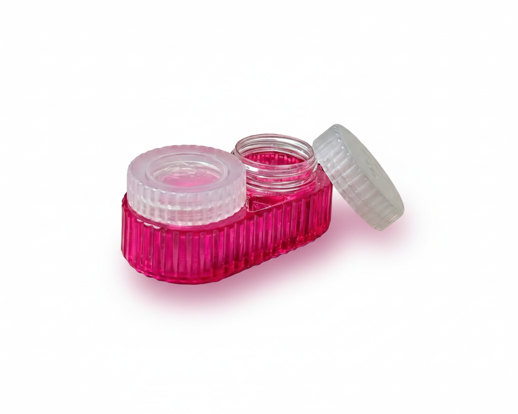 Pink contact lens case with two lenses on a transparent background
